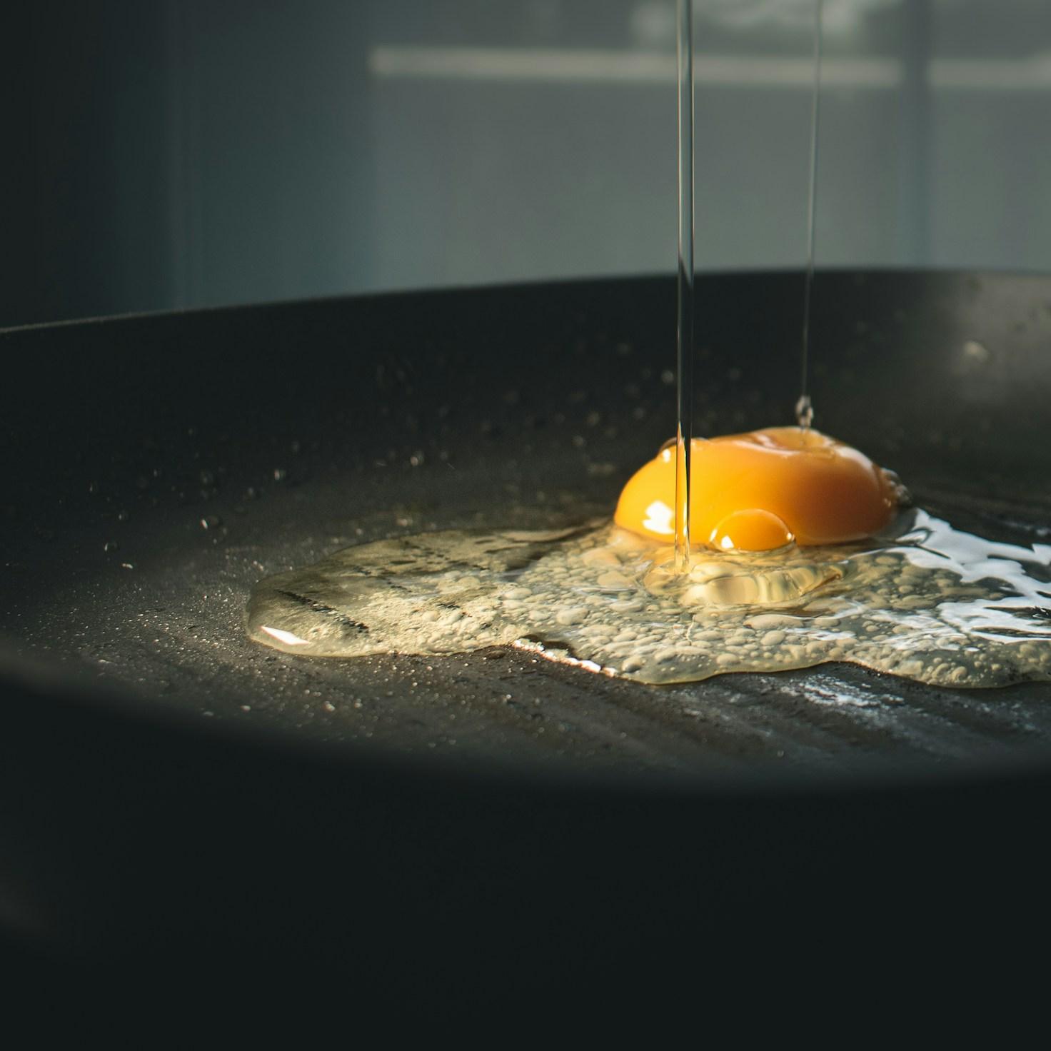 Community members collaborating in a modern kitchen space, sharing recipes and cooking techniques